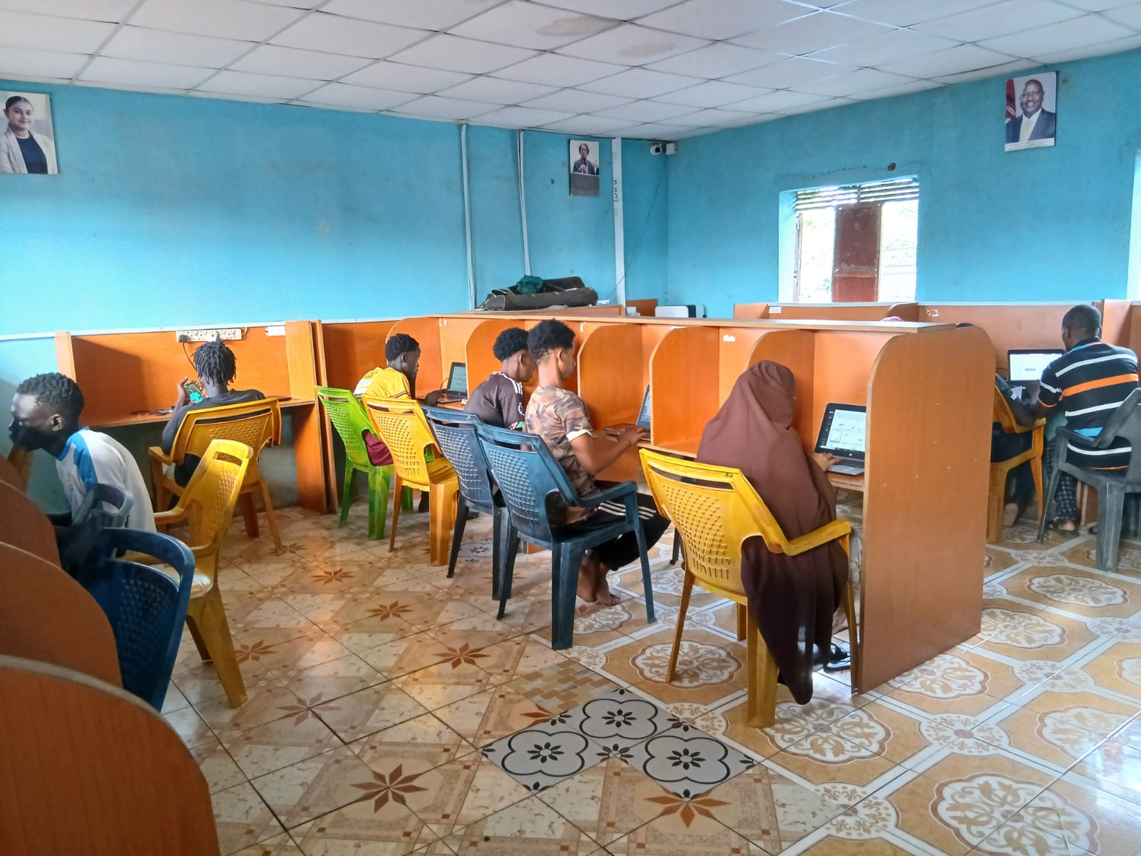 Youth learning computer skills in Kakuma